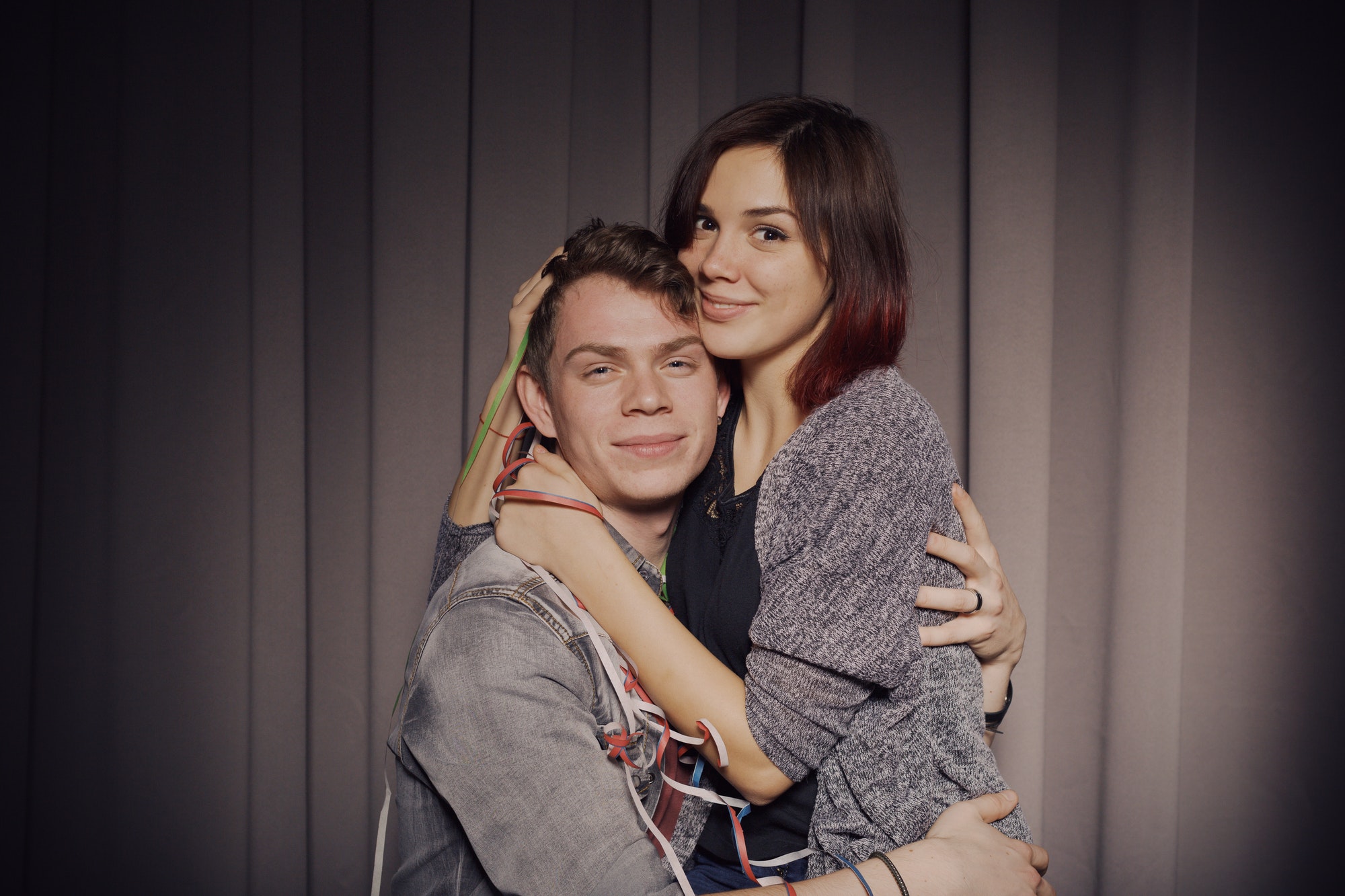 Happy couple in a photo booth